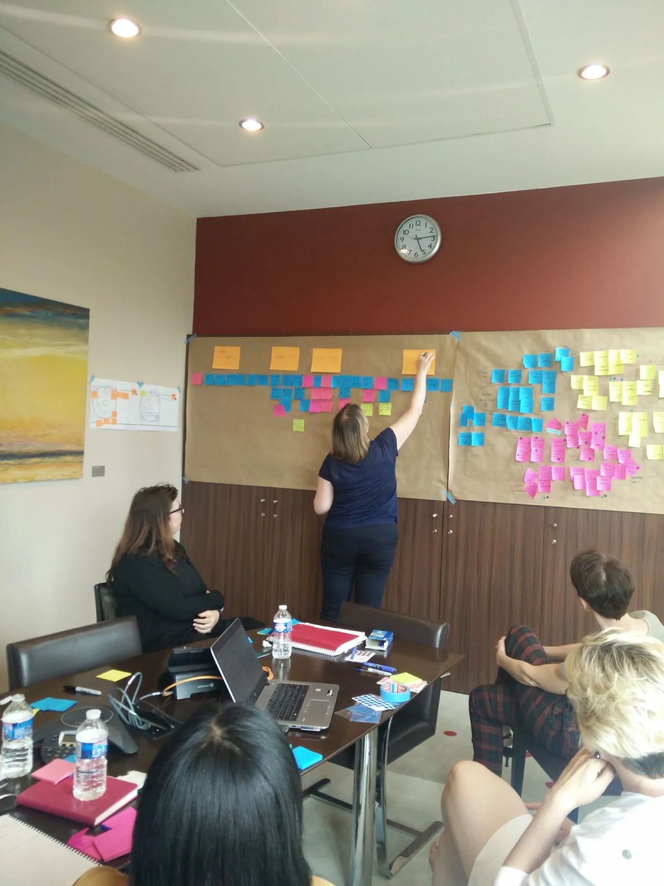 Participant placing stage headers while building the journey map timeline